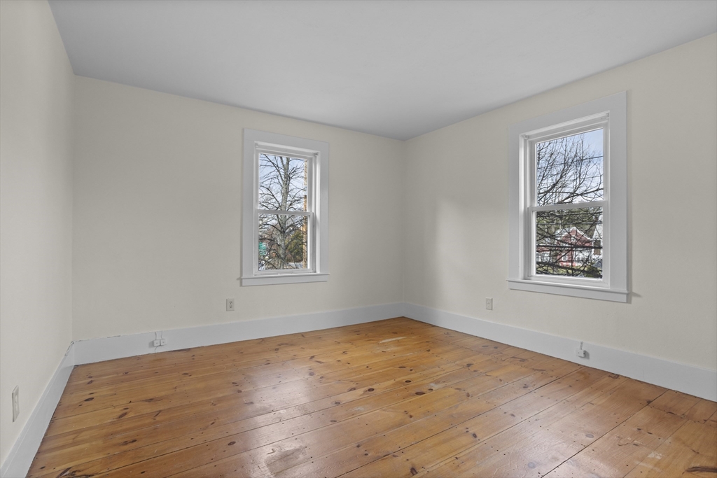294 Great Road, Unit 2 Littleton, MA 01460 - Photo 5 of 18 a view of empty room with window