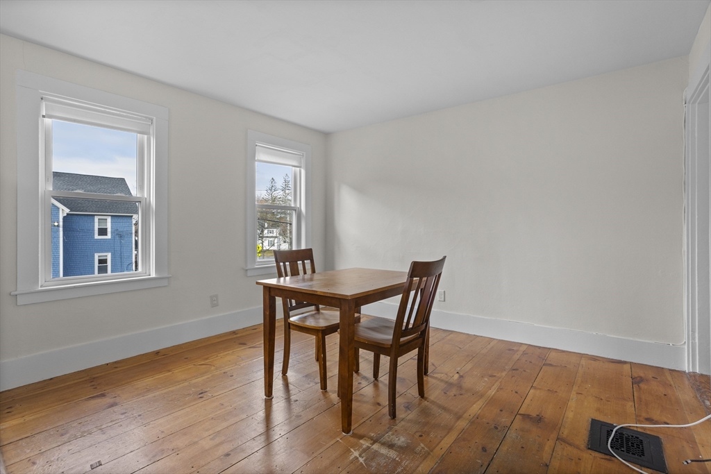 294 Great Road, Unit 2 Littleton, MA 01460 - Photo 10 of 18 a view of a dining room with furniture and wooden floor