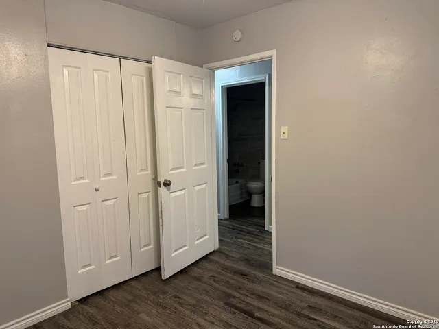 a view of a livingroom with wooden floor