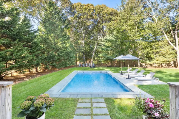 a view of a backyard with a patio
