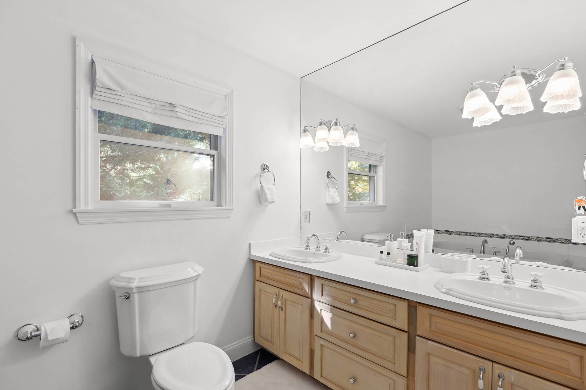 32 Old Fish Cove Road Southampton, NY 11968 - Photo 16 of 23 a bathroom with a toilet sink and mirror
