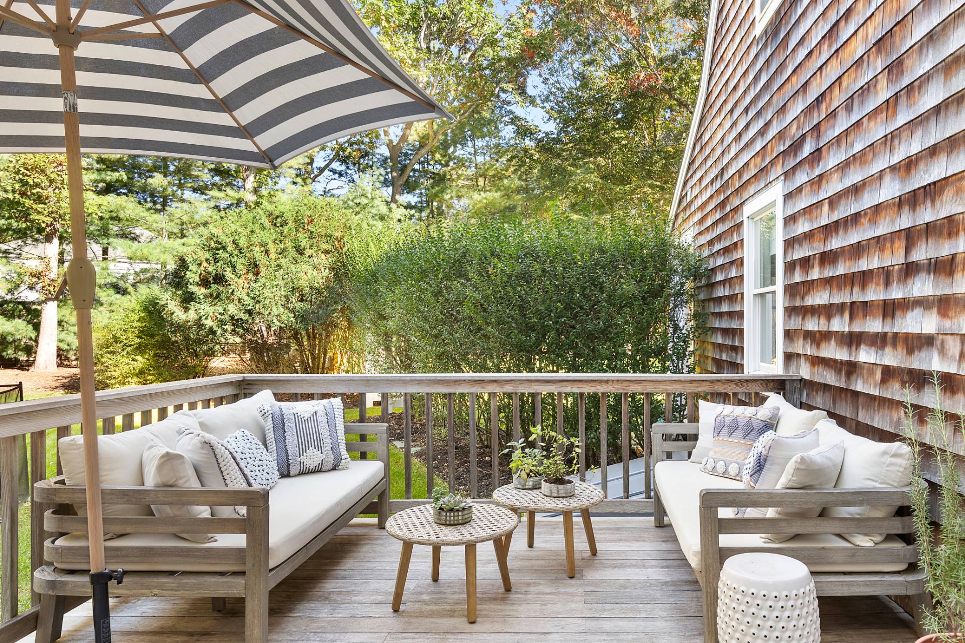 32 Old Fish Cove Road Southampton, NY 11968 - Photo 21 of 23 a balcony with wooden floor and outdoor seating