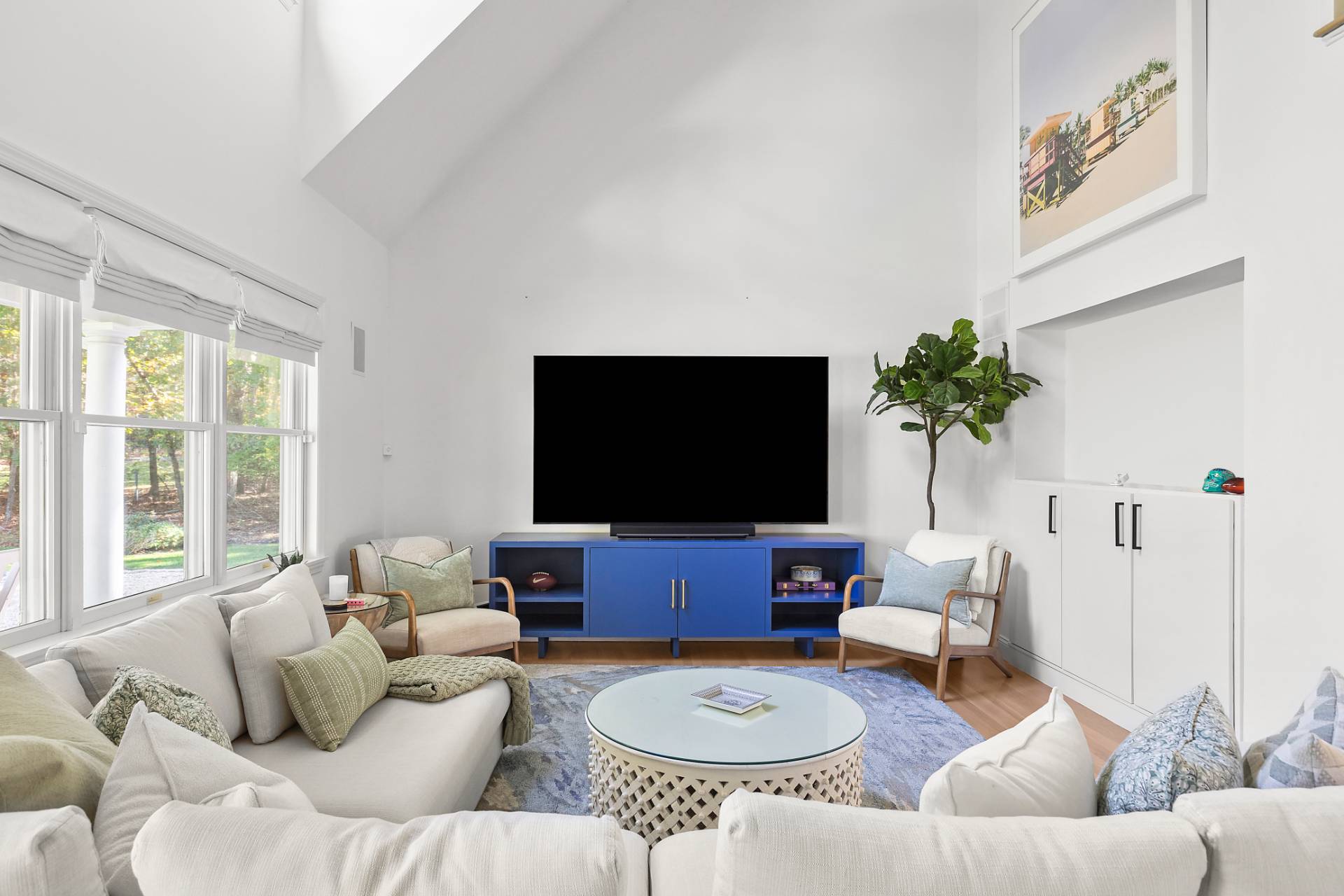 32 Old Fish Cove Road Southampton, NY 11968 - Photo 4 of 23 a living room with furniture and a flat screen tv