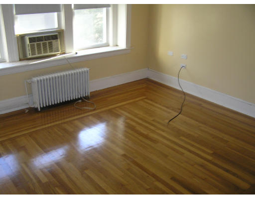 26-28 Harding Road Norwood, MA 02062 - Photo 4 of 6 a view of an empty room with a window and wooden floor