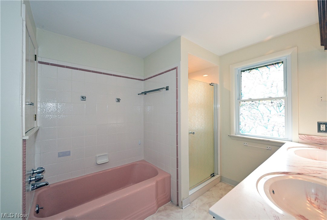 3798 Hillbrook Road Cleveland, OH 44118 - Photo 28 of 34 Bathroom featuring tile flooring, double vanity, and plus walk in shower