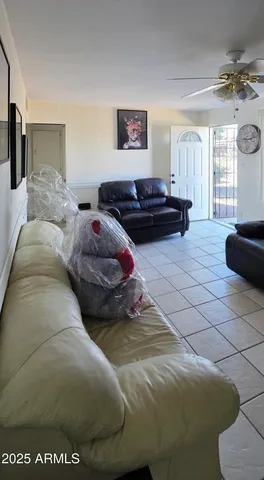 a bedroom with two beds and a couch