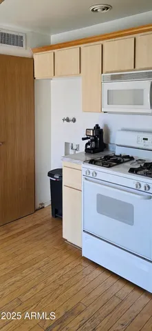 a kitchen with stainless steel appliances a stove and a refrigerator