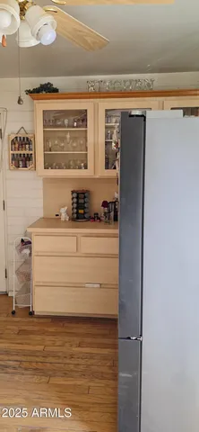 a kitchen with a refrigerator and a stove