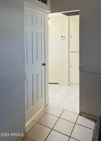 a view of a livingroom with wooden floor and closet