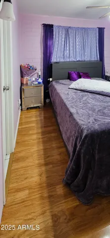 a view of a room with wooden shelves