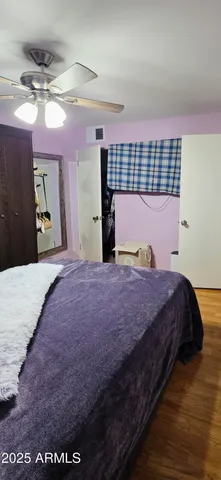 a view of a livingroom with furniture and a window