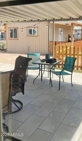 a view of a swimming pool with an outdoor space and seating area