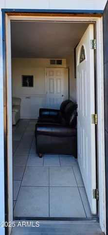 a living room with furniture and a rug