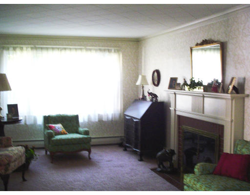 29 Prospect Hill Road Lexington, MA 02421 - Photo 3 of 8 a living room with furniture and a fireplace