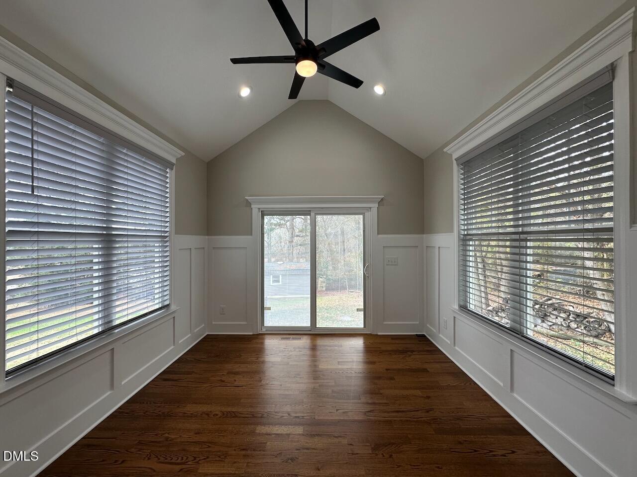 913 Clayton Road Benson, NC 27504 - Photo 12 of 35 a view of an empty room with wooden floor and a window