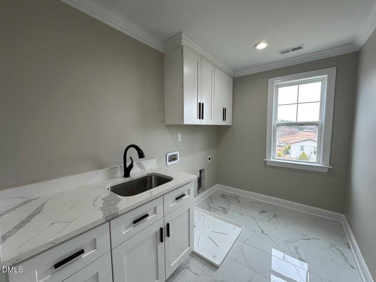 913 Clayton Road Benson, NC 27504 - Photo 27 of 35 a kitchen with a sink cabinets and window