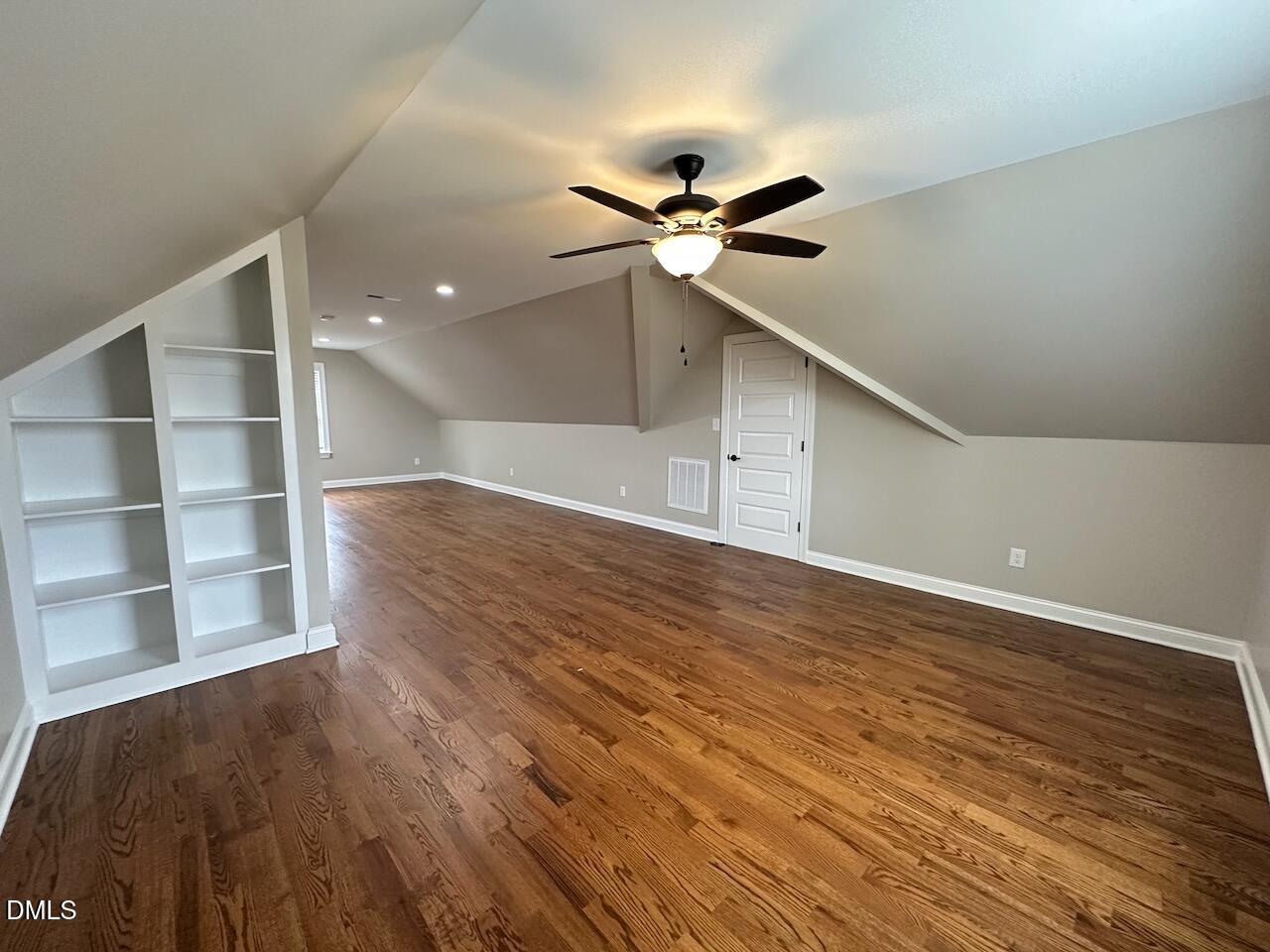 913 Clayton Road Benson, NC 27504 - Photo 30 of 35 a view of an empty room with a window and wooden floor