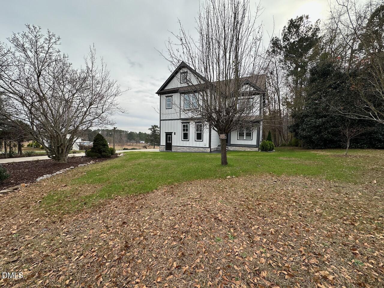 913 Clayton Road Benson, NC 27504 - Photo 3 of 35 a view of a house with a yard
