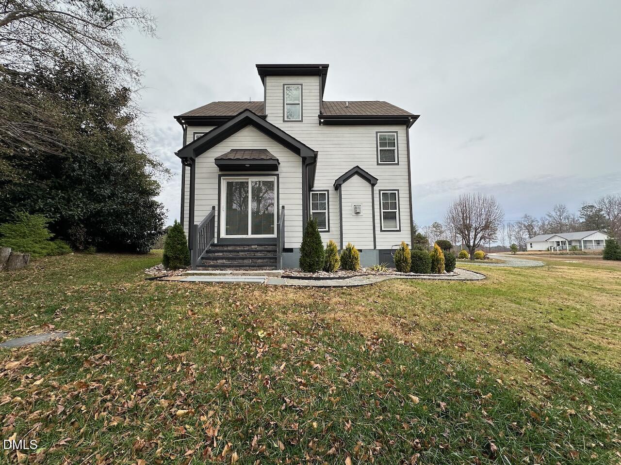 913 Clayton Road Benson, NC 27504 - Photo 34 of 35 a front view of a house with garden