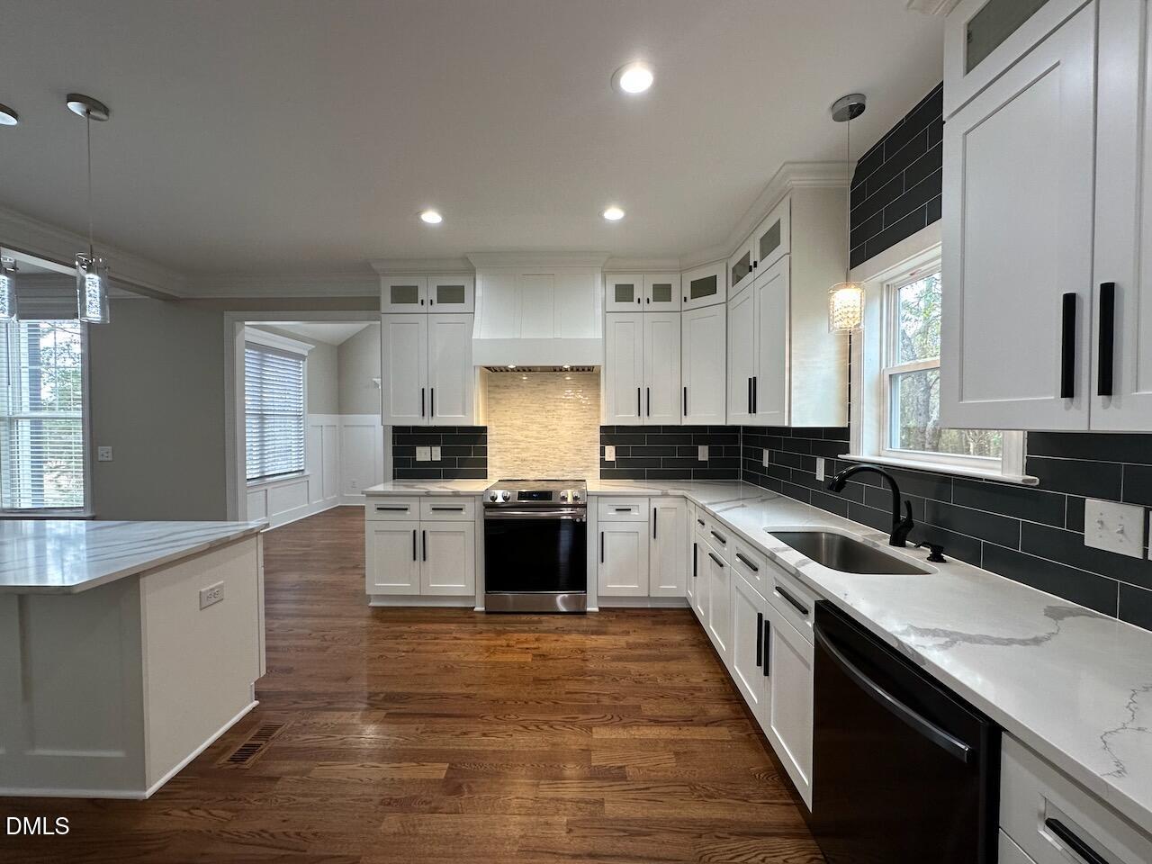 913 Clayton Road Benson, NC 27504 - Photo 9 of 35 a kitchen with a sink stove cabinets and refrigerator