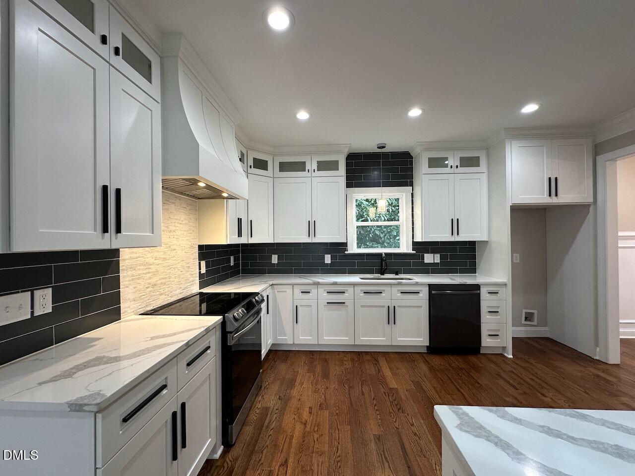 913 Clayton Road Benson, NC 27504 - Photo 10 of 35 a large kitchen with stainless steel appliances granite countertop a lot of counter space and wooden floor