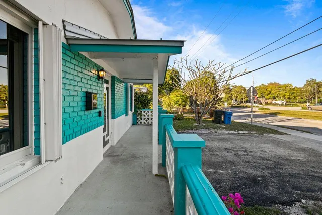 a view of room with wooden floor and ceiling fan