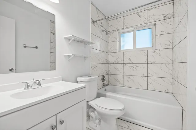 a kitchen with stainless steel appliances granite countertop a refrigerator a stove a sink and a microwave oven