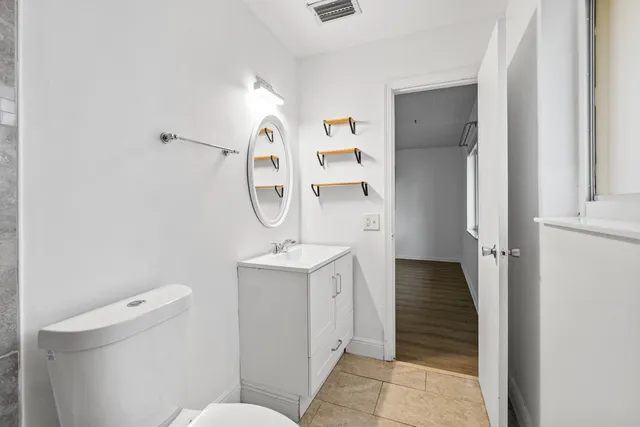 a view of a park with large trees