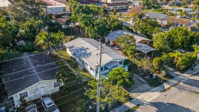 a bathroom with a sink toilet vanity and shower