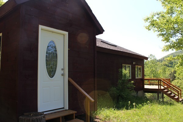 331 Adamsville Road Colrain, MA 01340 - Photo 4 of 30 a front view of a house with garden