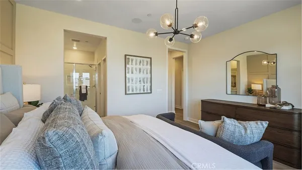 a bedroom with bed and window