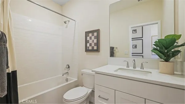 a bathroom with a sink a toilet and bathtub