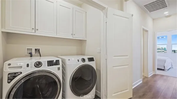 a view of entryway with washer and dryer