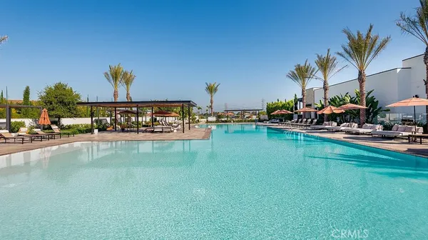a view of swimming pool with outdoor seating