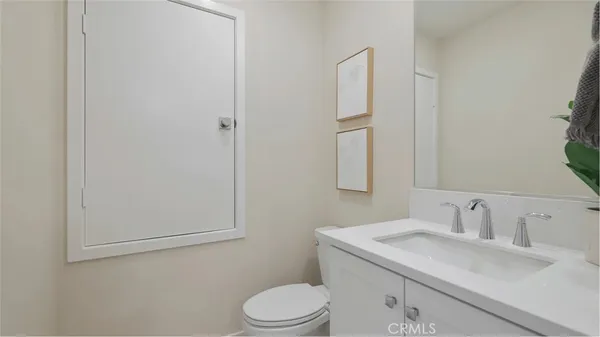 a bathroom with a sink toilet and vanity