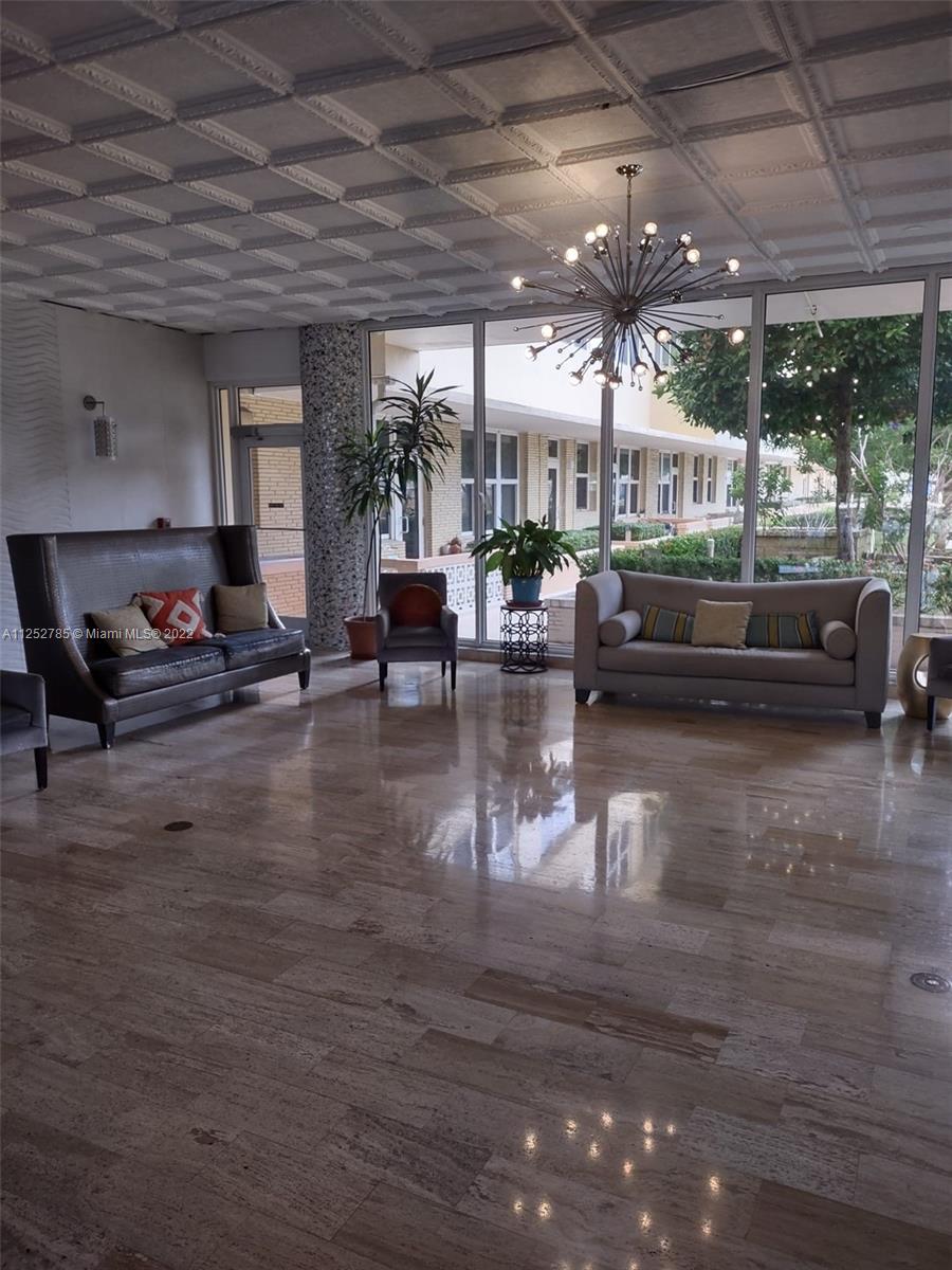 4747 Collins Avenue, Unit 107 Miami Beach, FL 33140 - Photo 1 of 15 a living room with furniture