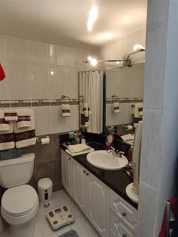 a bathroom with a bathtub a toilet and a shower