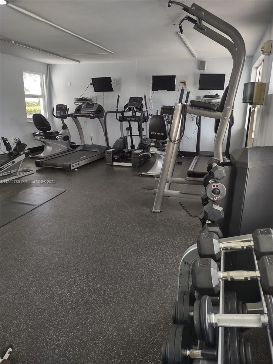4747 Collins Avenue, Unit 107 Miami Beach, FL 33140 - Photo 15 of 15 a view of a room with gym equipment