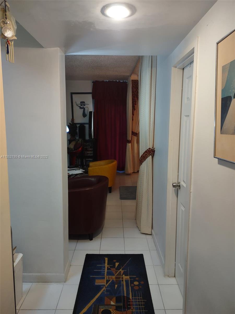 4747 Collins Avenue, Unit 107 Miami Beach, FL 33140 - Photo 5 of 15 a view of living room with furniture and a rug