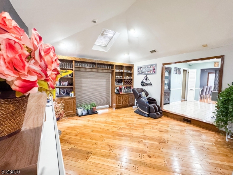 617 Sycamore Street Paramus, NJ 07652 - Photo 14 of 20 a view of a livingroom with furniture and a flat screen tv