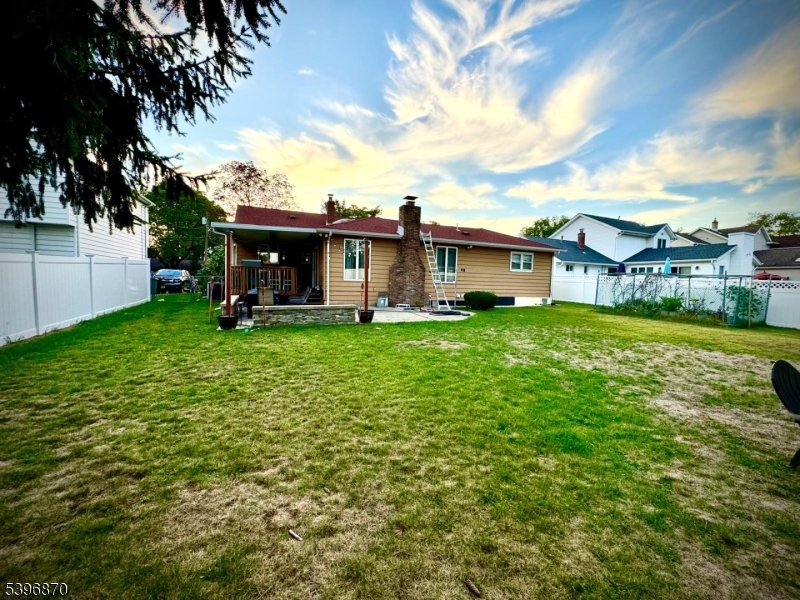 617 Sycamore Street Paramus, NJ 07652 - Photo 17 of 20 a view of a house with a yard porch and sitting area