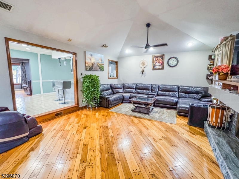 617 Sycamore Street Paramus, NJ 07652 - Photo 2 of 20 a living room with furniture and wooden floor