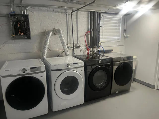 a utility room with dryer and washer