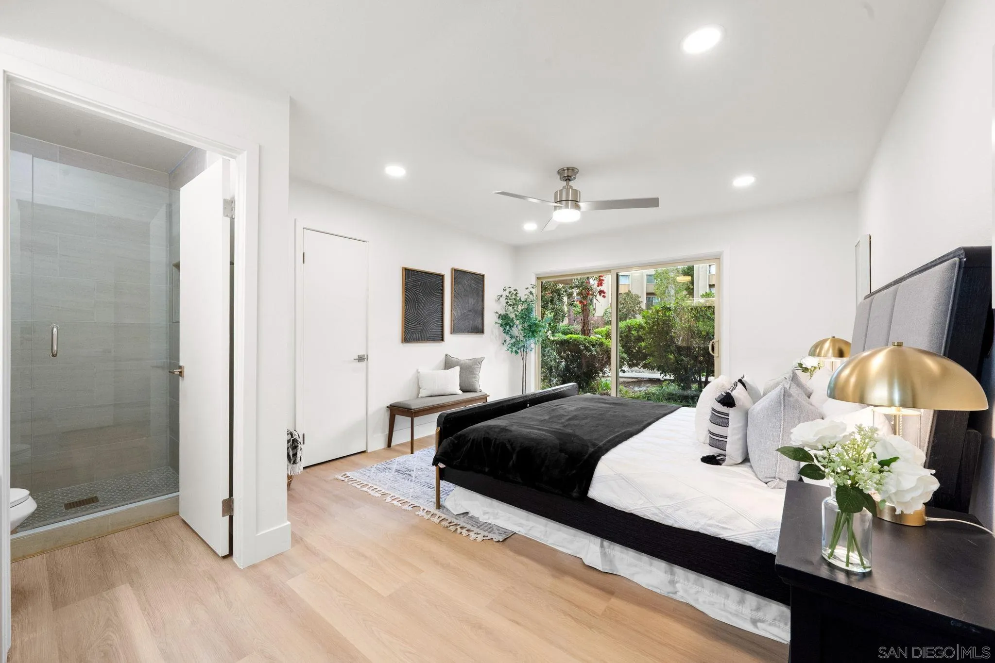 5700 Baltimore Drive La Mesa, CA 91942 - Photo 17 of 37 a bedroom with a large bed and a window