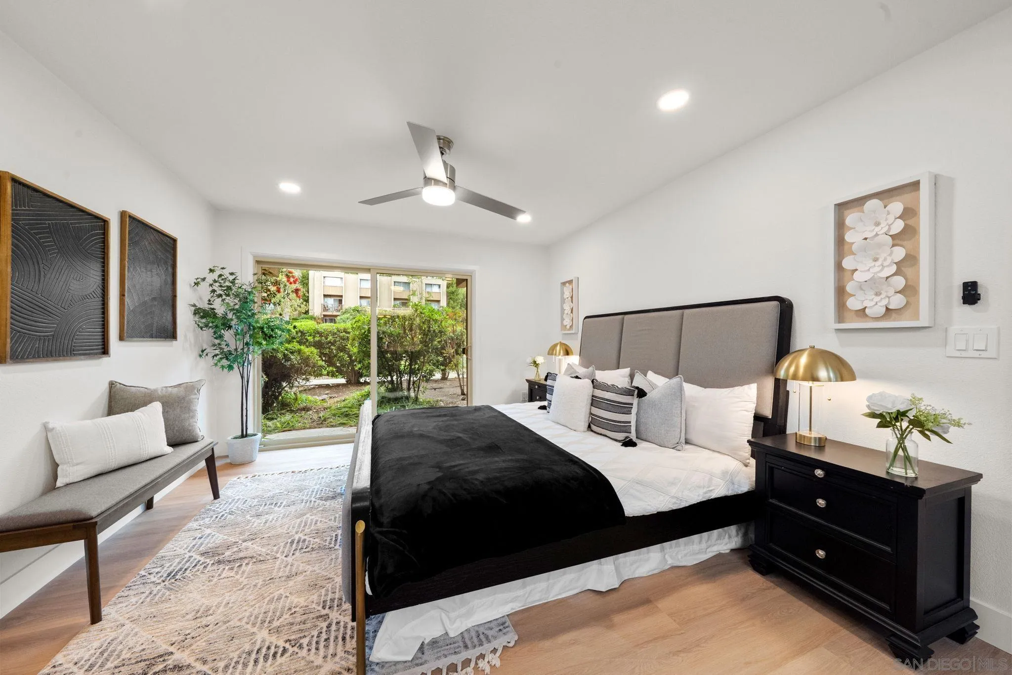 5700 Baltimore Drive La Mesa, CA 91942 - Photo 18 of 37 a bedroom with a bed and a couch