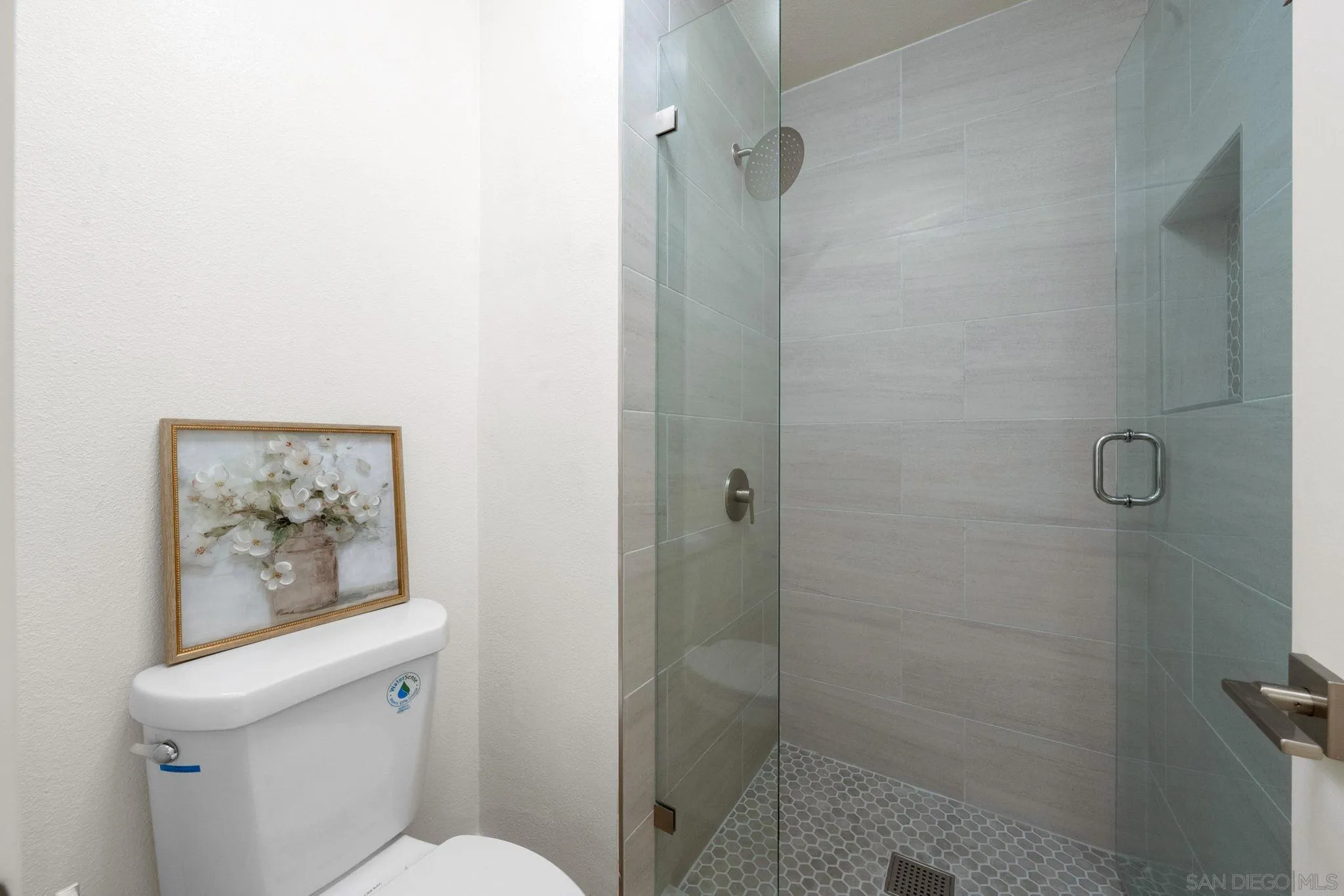 5700 Baltimore Drive La Mesa, CA 91942 - Photo 21 of 37 a white toilet sitting next to a bathroom sink