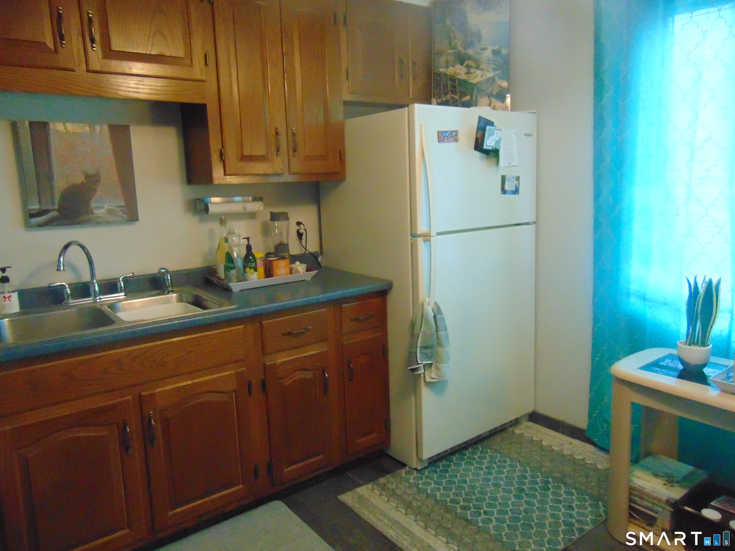 882 North Colony Road, Unit 31 Meriden, CT 06450 - Photo 12 of 34 a white refrigerator freezer sitting inside of a kitchen