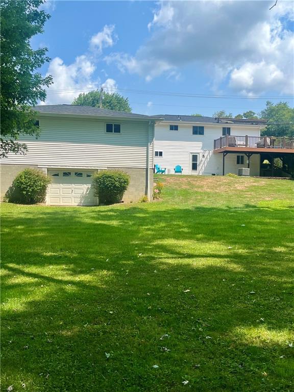 135 Lagonda Road Washington, PA 15301 - Photo 4 of 25 a front view of a house with a garden and yard
