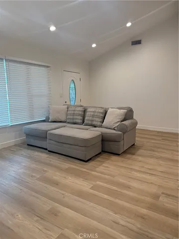 a living room with couches and a table