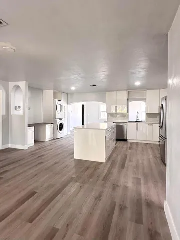 a view of kitchen and wooden floor